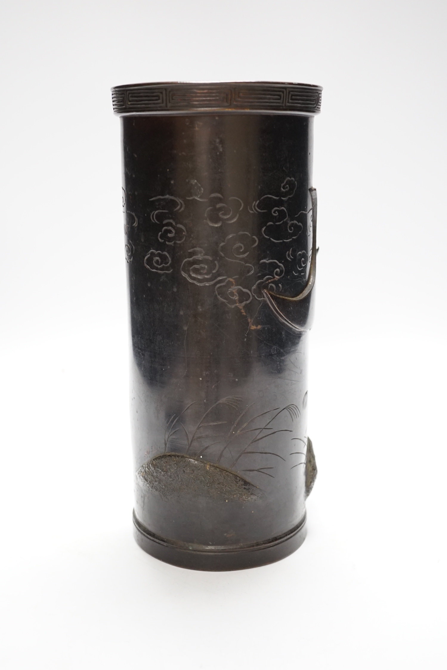 A Japanese bronze cylinder vase with applied bird, 28cm